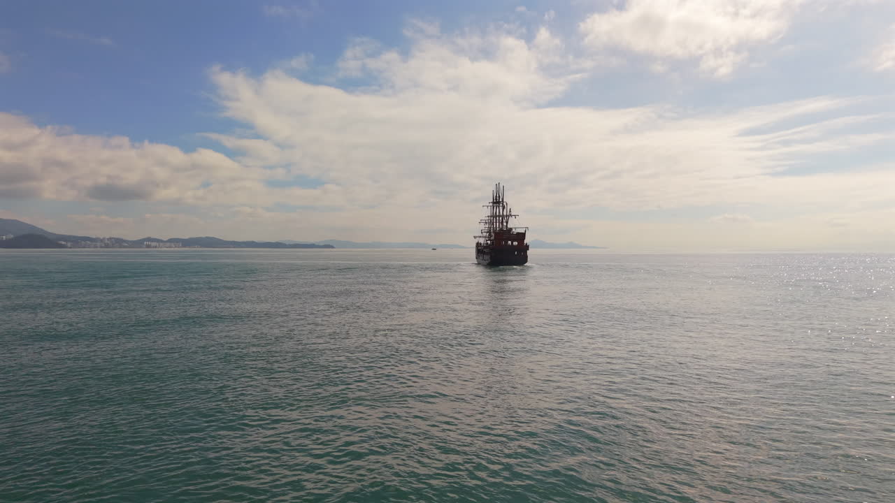 A grand pirate ship sails across Balneário Camboriú’s scenic bay waters