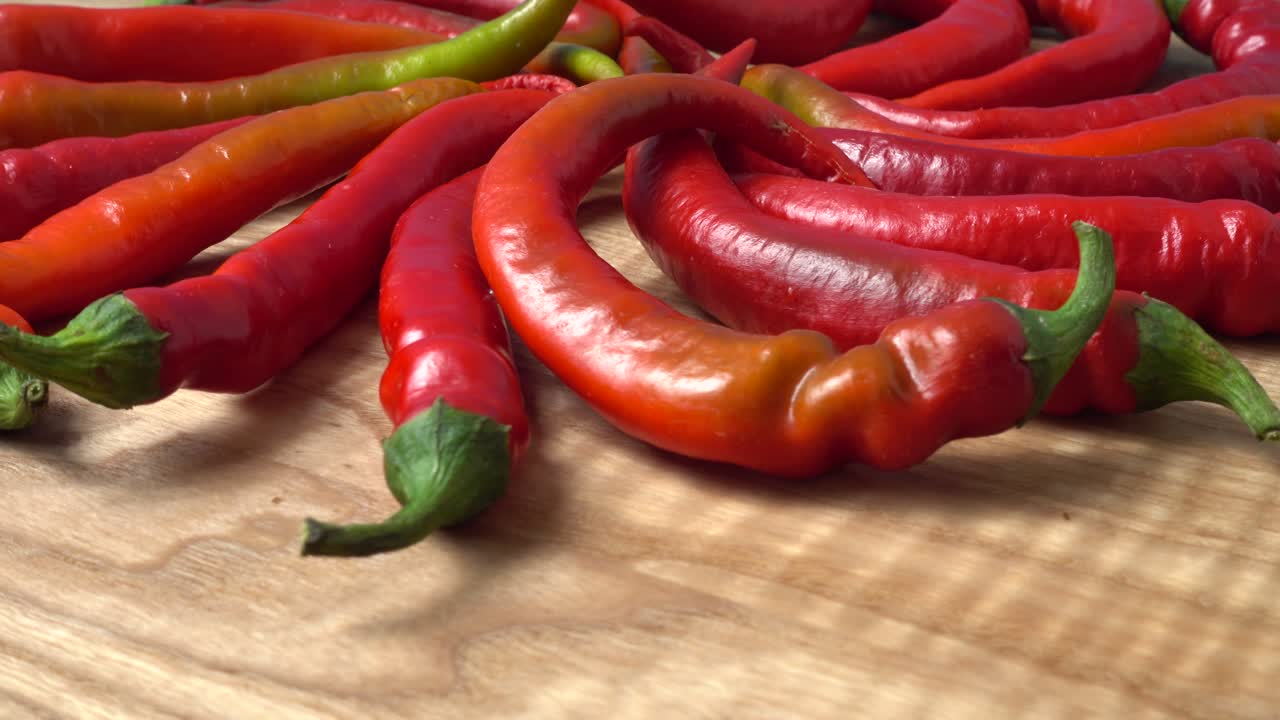 Red chilli, pepper. Shooting in the movement. Shooting in kitchen