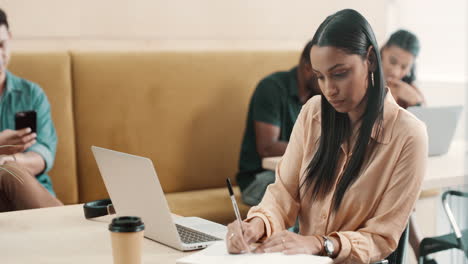 Focused-creative-businesswoman-typing-on-laptop