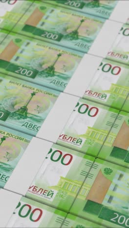 vertical video of 200 russian ruble banknotes printing by a money press