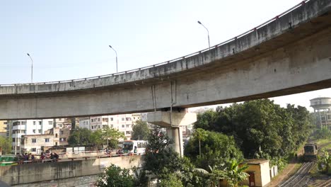 city overpass with vehicles and people