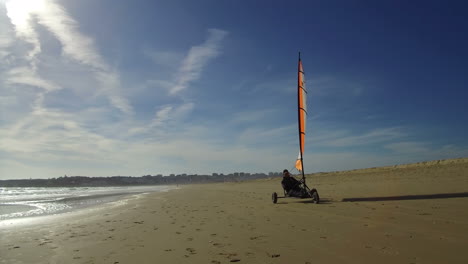 Sand-yachting-our-Windsurfing-on-sand,-in-a-beach,-in-Lagos-Algarve,-Portugal