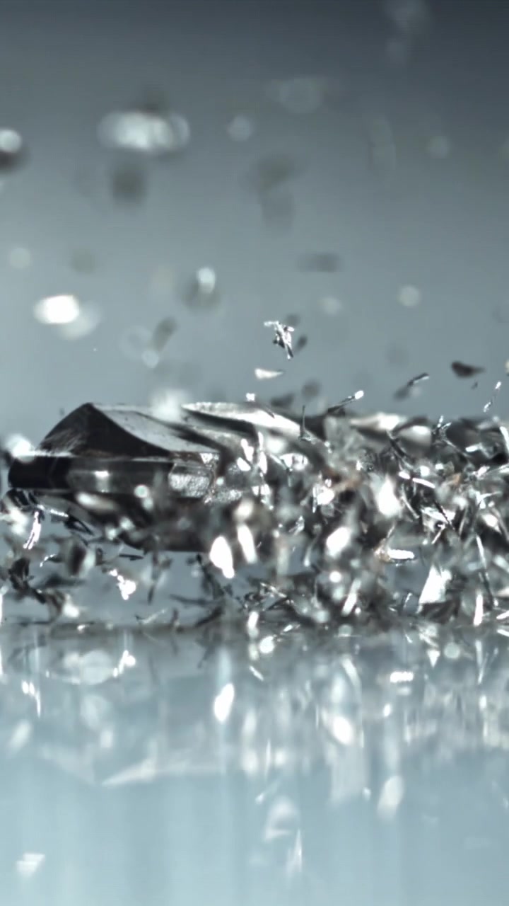 Macro Shot of a Drill Bit and Falling Metal Shavings