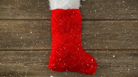 falling snow with christmas stocking decoration