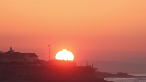 the sunrise above city buildings, close-up view