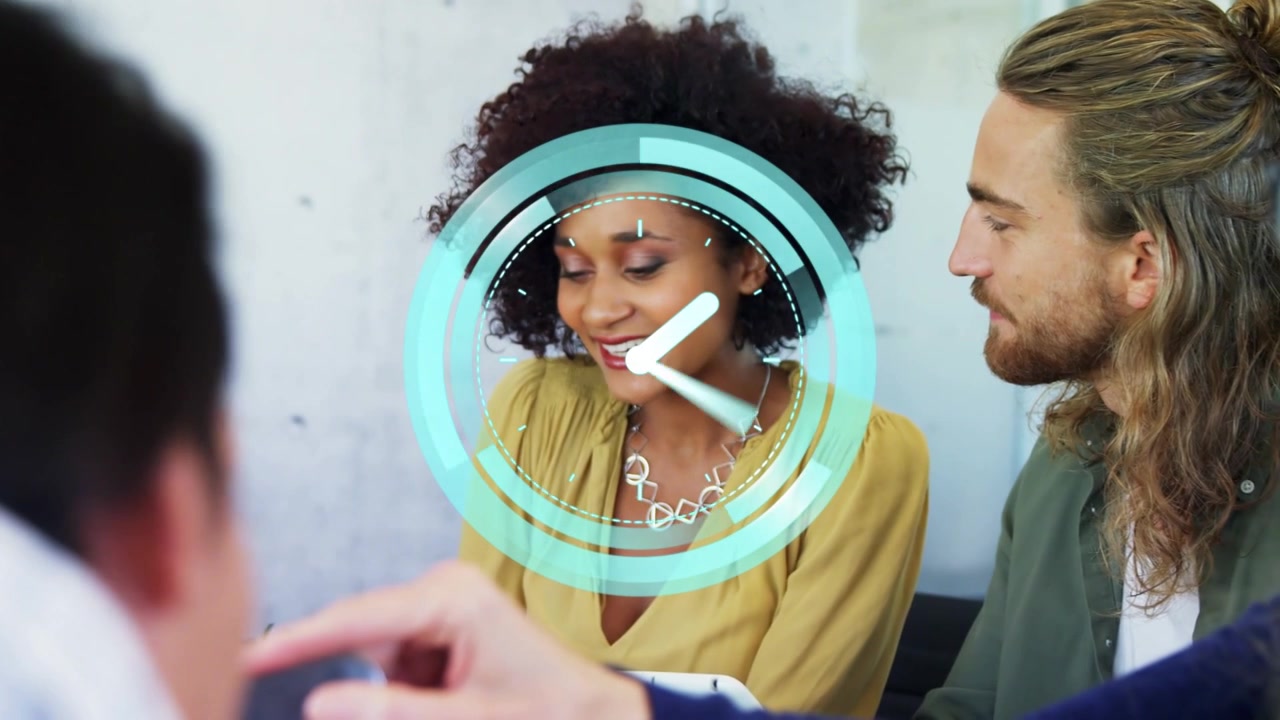 Woman in mustard top tapping device, leading business meeting, clock overlay appearing then fading