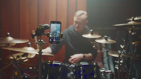 drummer playing in a studio recording session