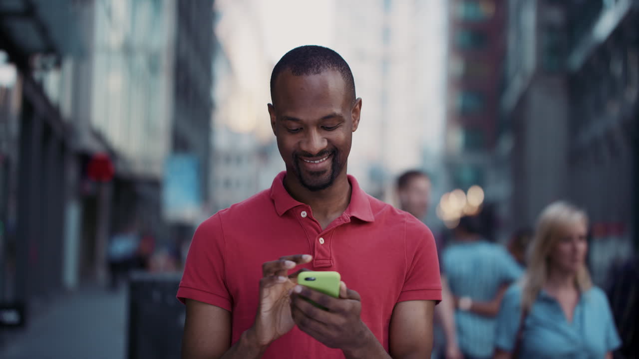 Slow Motion Portrait of happy african american man using smart phone