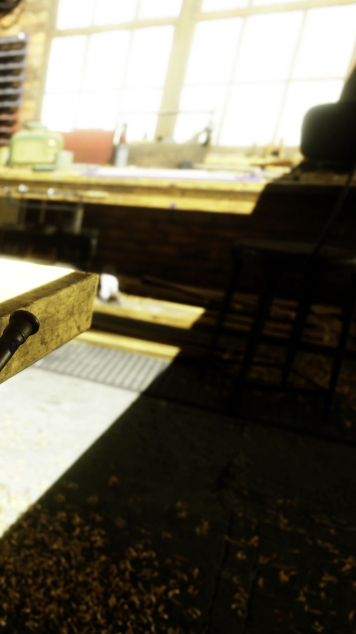 Wood shavings scatter in golden light as tools await next creation
