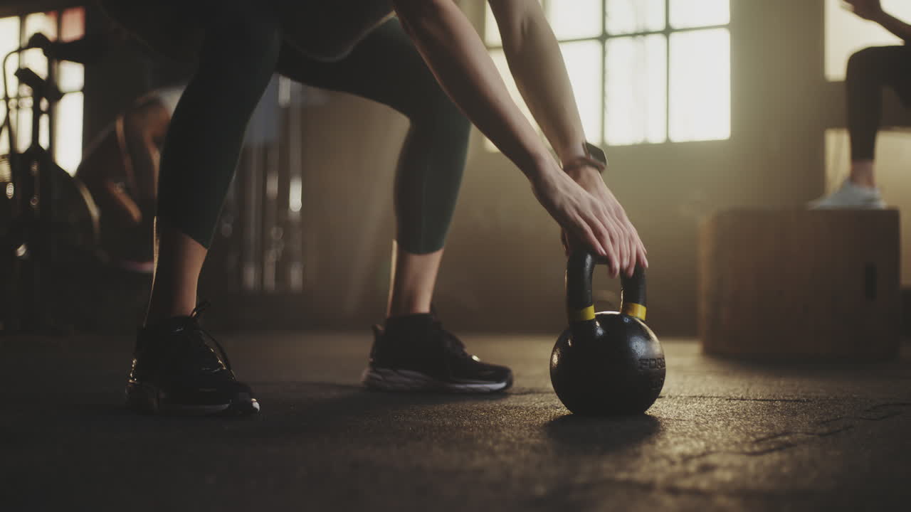 Woman in Gym with Kettlebell