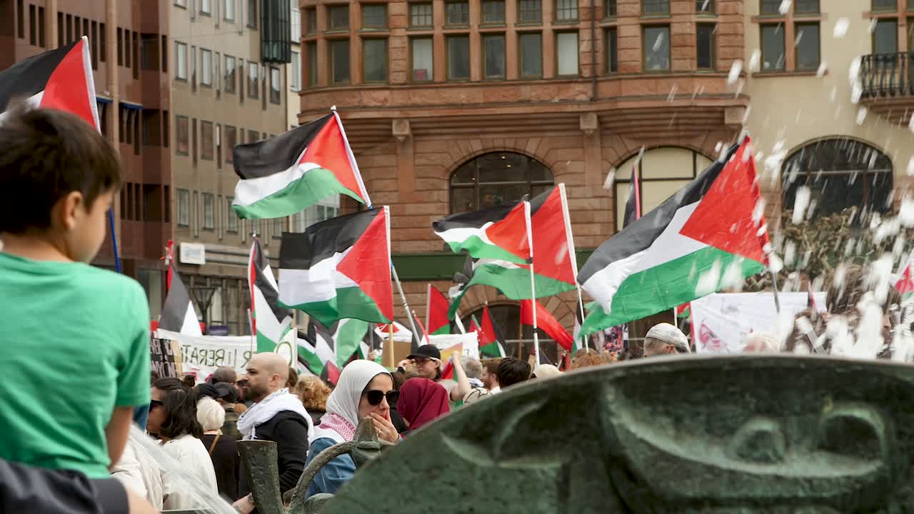 Pro Palestine protesters march against Israel’s Eurovision participation in Malmö (Sweden), calling for a ceasefire on the war in Gaza, Eurovision song contest 2024, medium handheld shot
