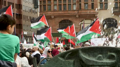 pro palestine protesters march against israel’s eurovision participation in malmö (sweden), calling for a ceasefire on the war in gaza, eurovision song contest 2024, medium handheld shot