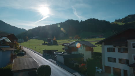 Morning-balcony-view-of-tranquil-mountainside-road-in-Tirol-Austria,-wide-angle