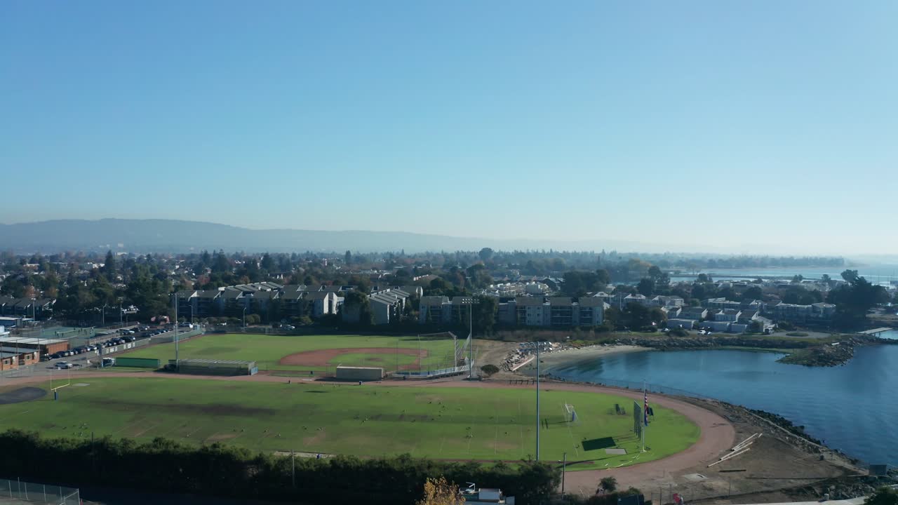 A long ascent into the blue sky above the urban city landscape