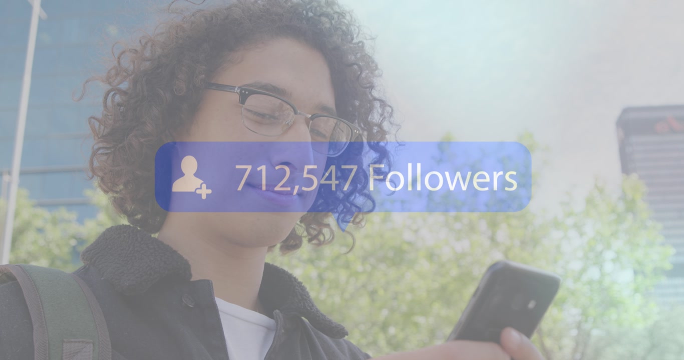 Animation of thank you text over african american sportsman at stay using smartphone