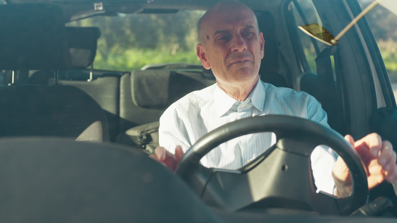 Elderly Man Sings Happily While Waiting in the Car