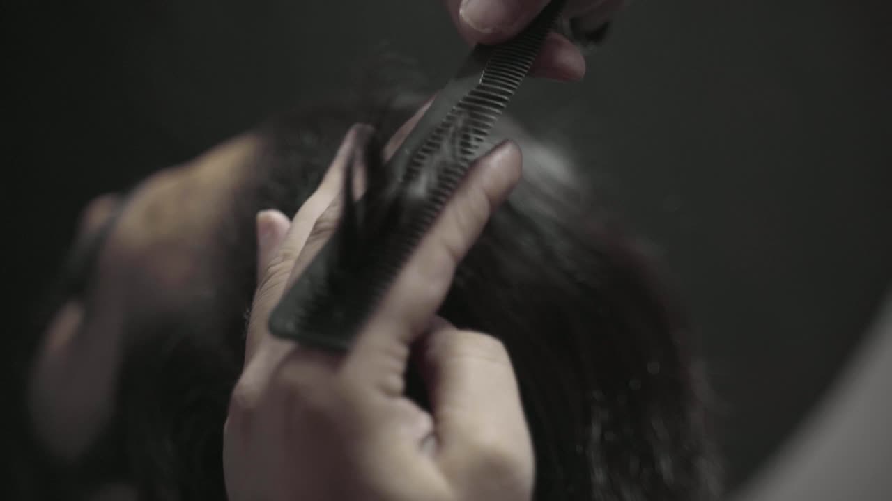 Closeup Of Hairdresser Styling Mens Hair In A Barbershop In Pakistan