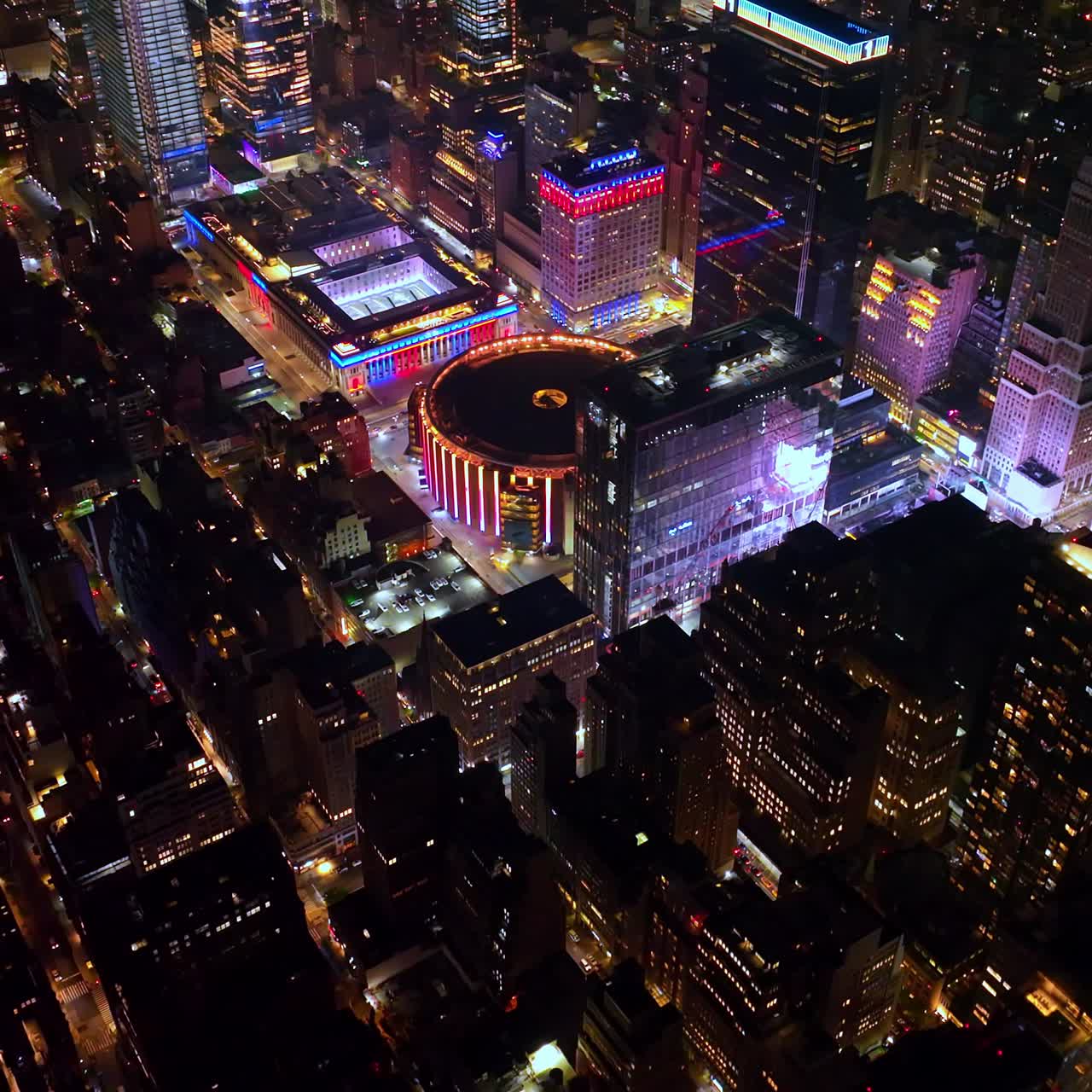 Wonderful round building of Overhaul Penn Station standing out in New York panorama. Fantastic city scenery at night time