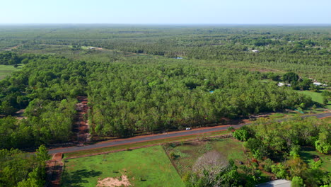 Aerial-Drone-Block-of-Land-with-Trees,-Sub-Division,-Dirt-Road,-Blue-Skies,-Vacant-Land,-Cars-Driving-on-Road,-in-Rural-Humpty-Doo-NT