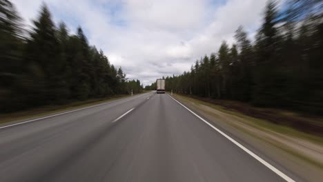 fast hyperlapse pov: following semi truck on country highway, cloud