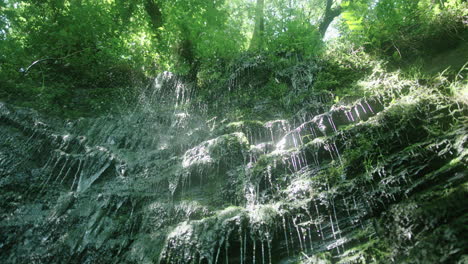 green waterfall  and slowing water in slowmotion