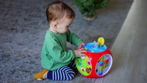 baby playing with a round toy