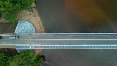 new bridge across a countryside river - straight down aerial inspection