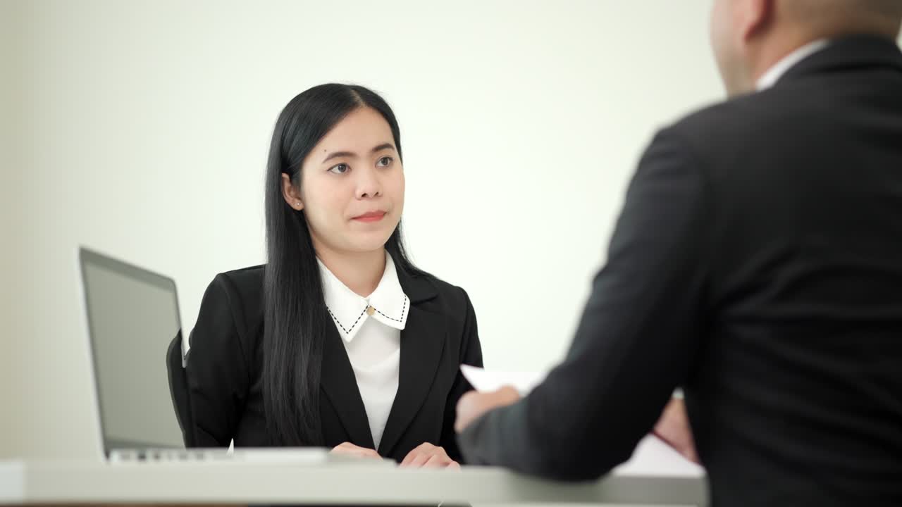 Business woman  to greet a HR staff before a job interview to apply for a job. Happy woman seeker or insurance broker presenting a business deal. Smart asian woman sending resume.