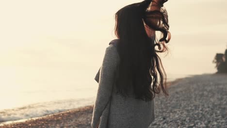 woman on a beach at sunrise/sunset