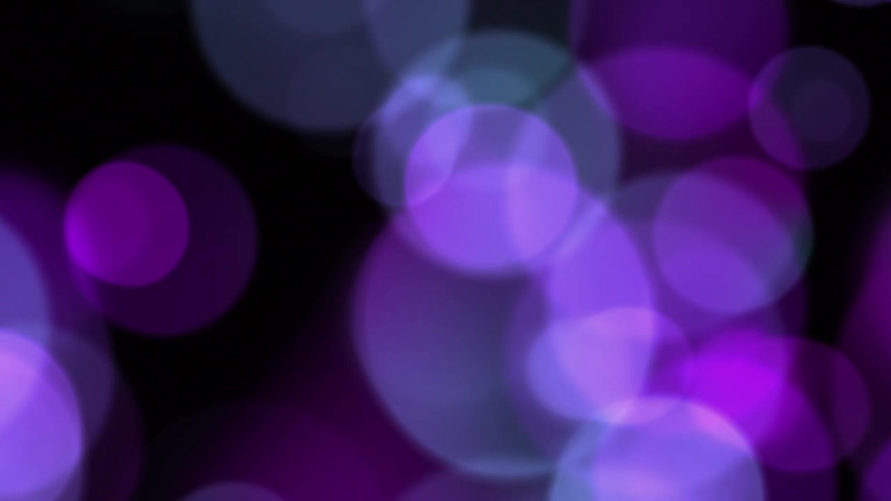 Abstract Purple and Blue Bokeh Lights Moving on Black Background