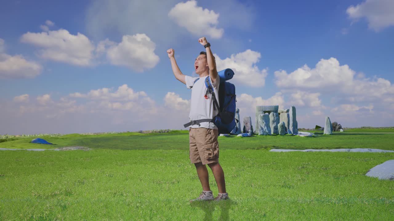 Full Body Side View Of Asian Male Hiker With Mountaineering Backpack Screaming Goal Celebrating The Success While Traveling In Stonehenge