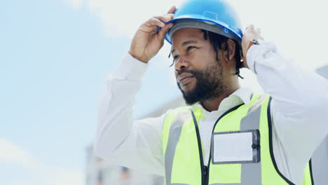 black man, engineer and safety helmet in the city