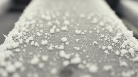 winter frost abstract background, macro pull forward of icy wooden board