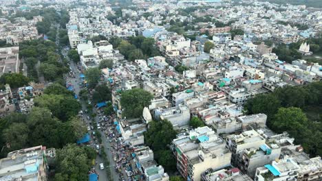 4k aerial shots of new delhi residential suburbs on a beautiful day gliding over rooftops, streets, parks and markets in india