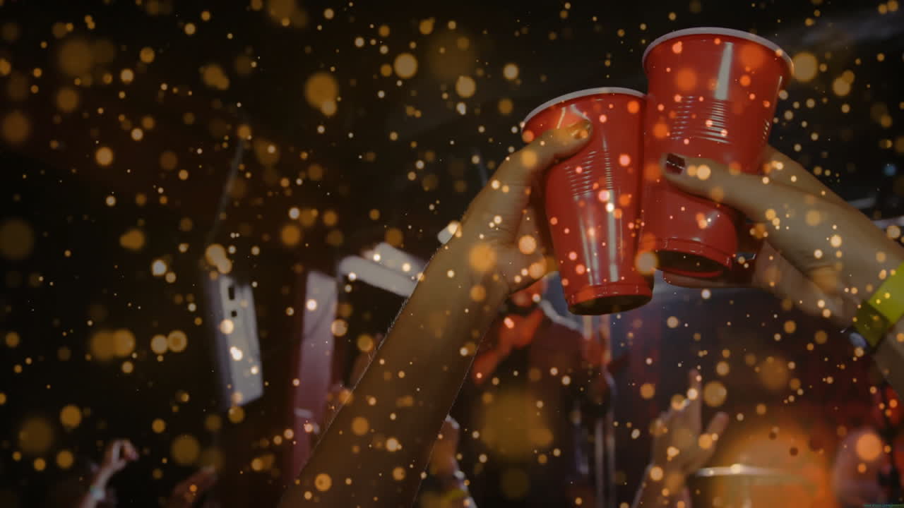 partygoers clinking red plastic cups in marketing event, featuring animated gold confetti overlays