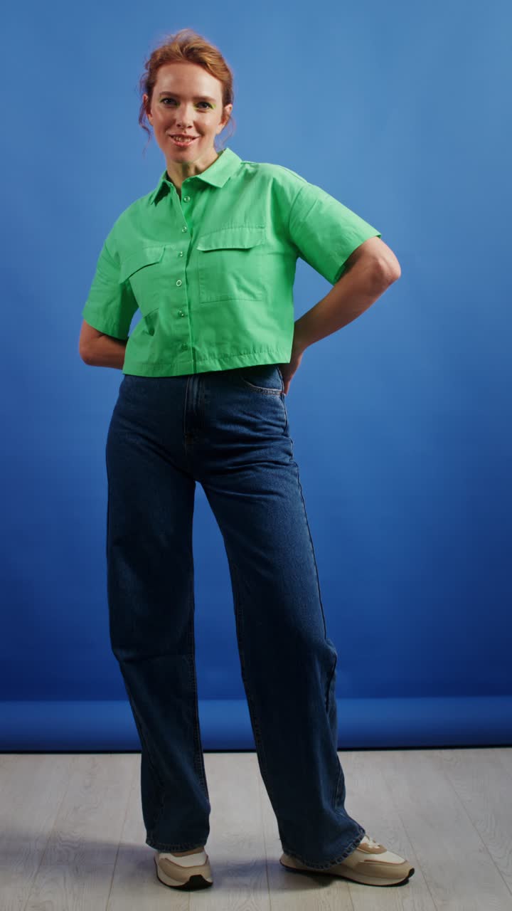Woman in Green Shirt and Wide-Leg Jeans