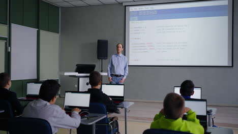 teacher leading a coding class