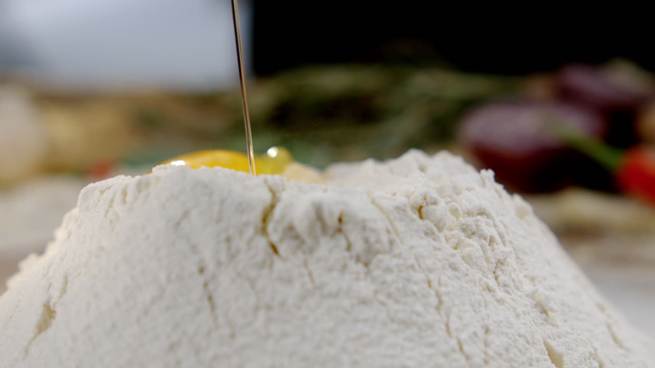 Adding Egg to Flour for Baking