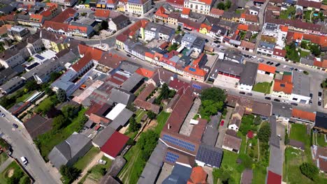 flying above poysdorf town in austria during summer - drone shot