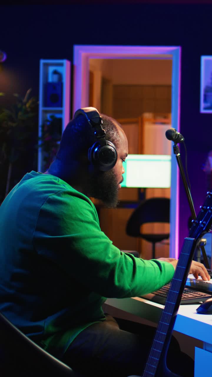 African American Man Composing Music in a Home Studio
