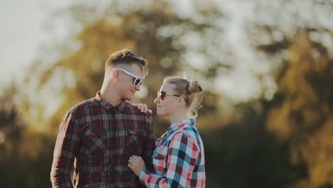 couple in love in the countryside. happy in love couple smiling and hugging eachother outdoor