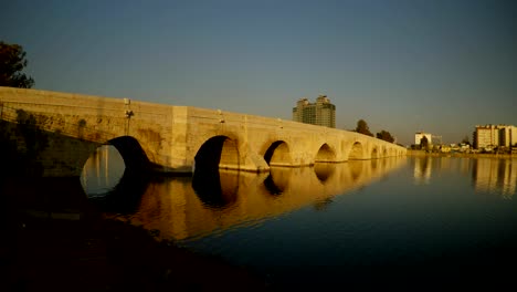 old rome stone bridge,built over 2000 years ago, the city of adana summer sunny morning