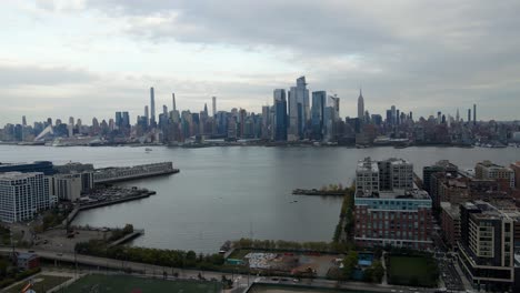 aerial view the hudson yards skyline, from hoboken jersey city, in new york - circling, drone shot