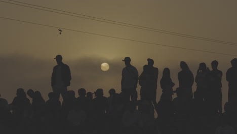 crowd watching sunset