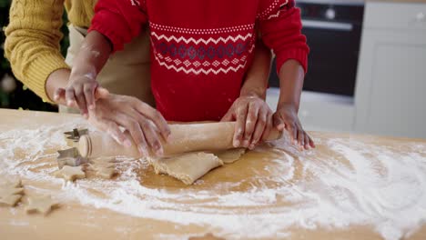 Close-Up-Of-Female-Hands-With-Little-Cute-Child-At-Table-In-Home-Kitchen-Making-Dough-For-Cookies