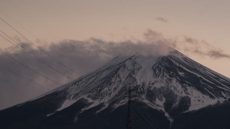 mount fuji at sunrise/sunset with power lines