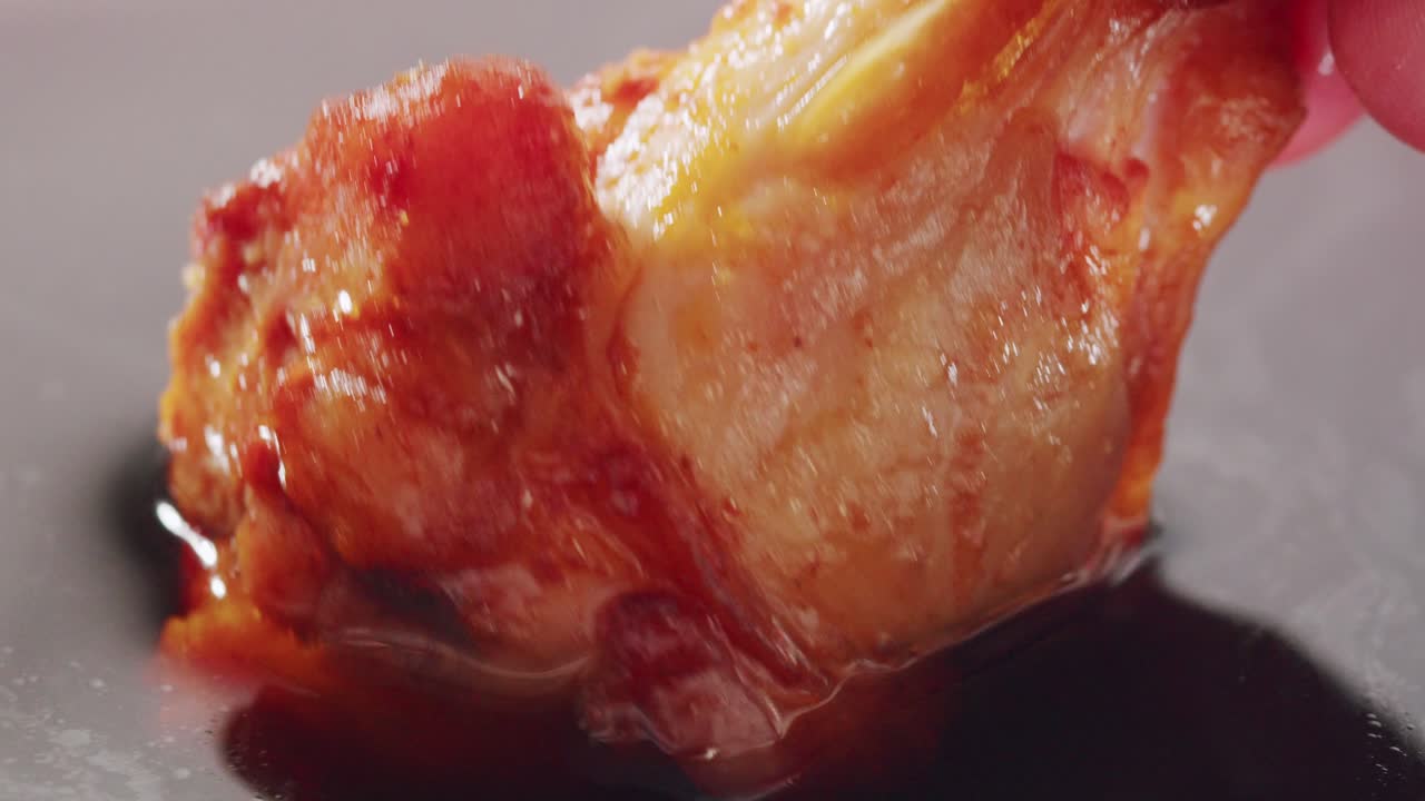 Close-up of a crispy chicken wing