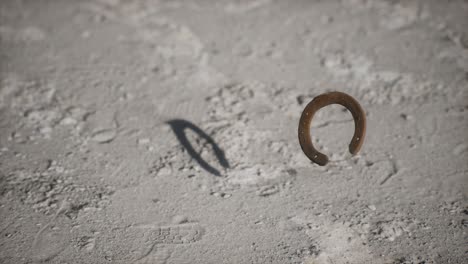 extreme slow motion old rusty metal horseshoe