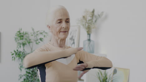 senior woman stretching at home