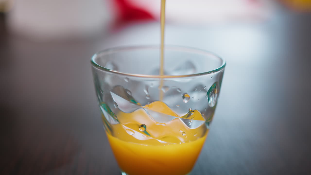 Pour Italian Orange Juice Rich In Vitamin C Into a Glass